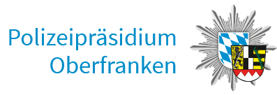 Auf dem Logo des Polizeipräsidiums Oberfranken sieht man eine Polizeimarke mit Bayernwappen und dem Wappen von Oberfranken